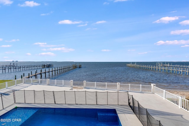 outdoor pool featuring a water view