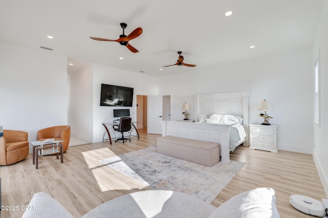 bedroom featuring visible vents, baseboards, a ceiling fan, light wood-style flooring, and recessed lighting