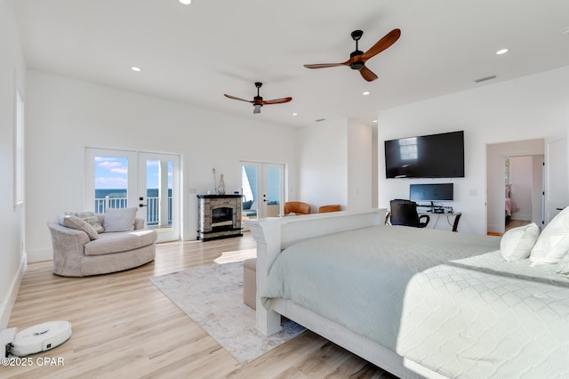 bedroom featuring recessed lighting, visible vents, access to outside, french doors, and light wood finished floors