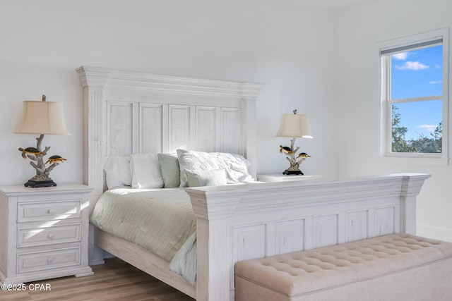 bedroom with wood finished floors