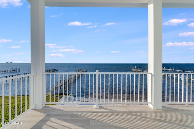 balcony featuring a water view