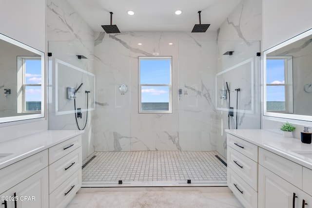 full bath with marble finish floor, recessed lighting, a marble finish shower, and vanity