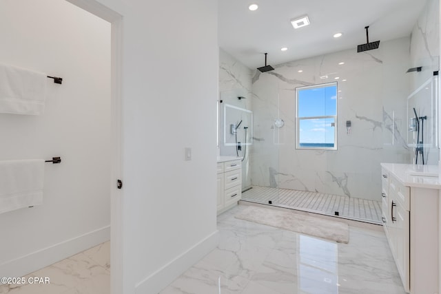 bathroom featuring marble finish floor, a marble finish shower, recessed lighting, vanity, and baseboards