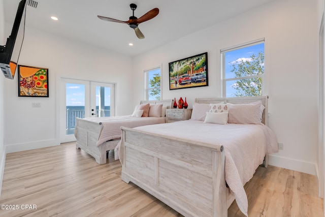 bedroom with baseboards, access to outside, french doors, light wood-style floors, and recessed lighting