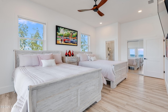 bedroom featuring visible vents, light wood-style flooring, and recessed lighting