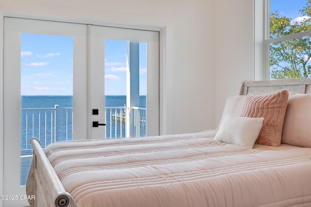 bedroom featuring a water view