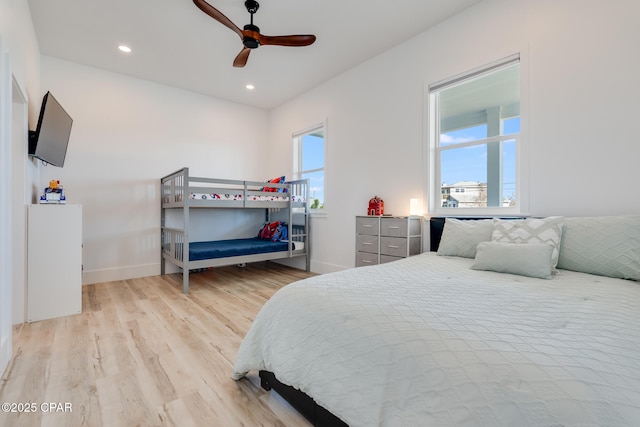 bedroom with light wood-style floors, recessed lighting, ceiling fan, and baseboards