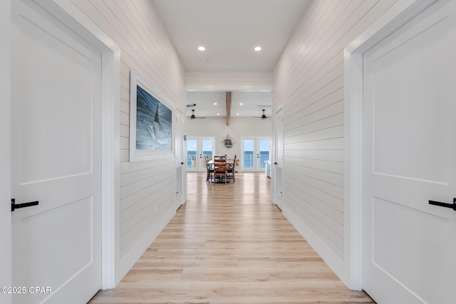 hallway featuring recessed lighting, french doors, and light wood-style flooring