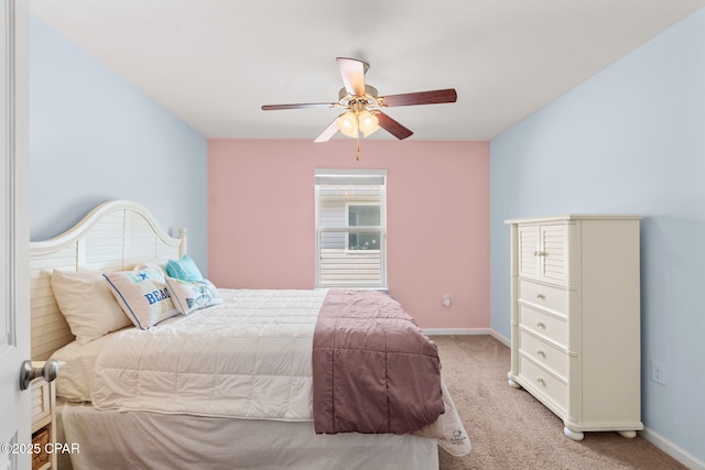 bedroom featuring ceiling fan, carpet, and baseboards