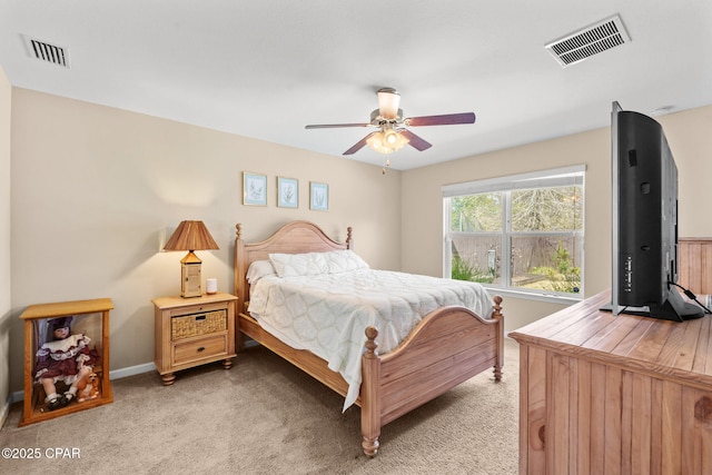 bedroom with light carpet, baseboards, visible vents, and a ceiling fan