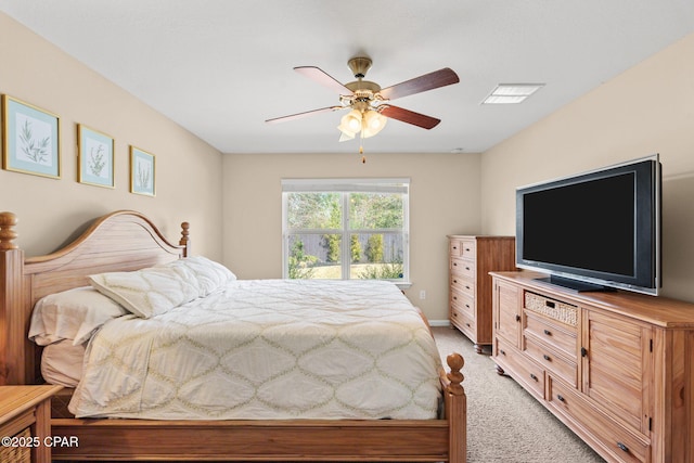 bedroom with ceiling fan, visible vents, and light colored carpet