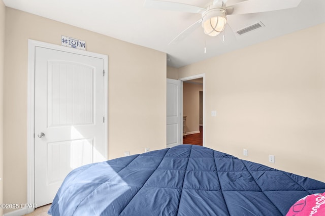 bedroom featuring a ceiling fan and visible vents