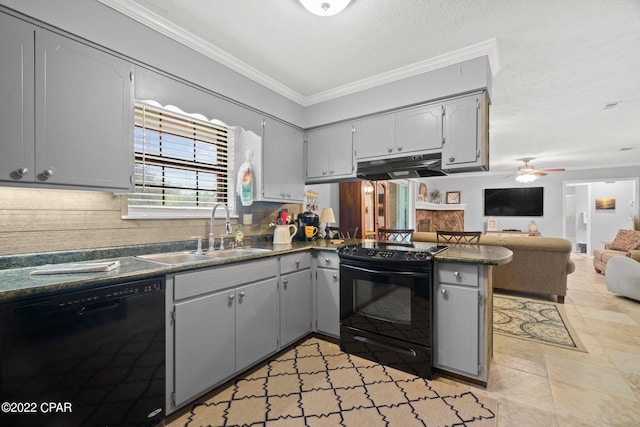 kitchen with under cabinet range hood, a peninsula, a sink, black appliances, and dark countertops