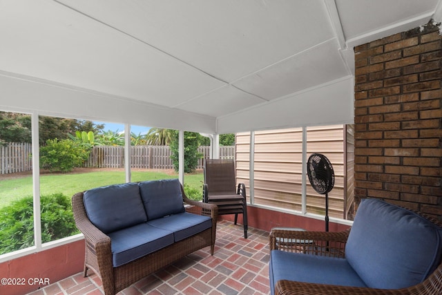 sunroom with vaulted ceiling and plenty of natural light