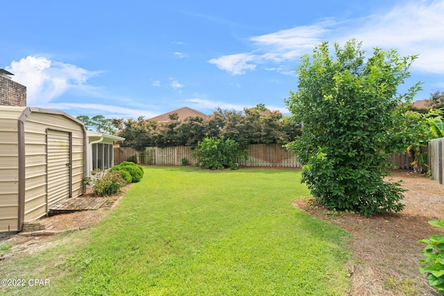 view of yard with a fenced backyard