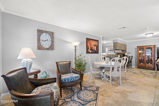 interior space with visible vents, baseboards, and crown molding