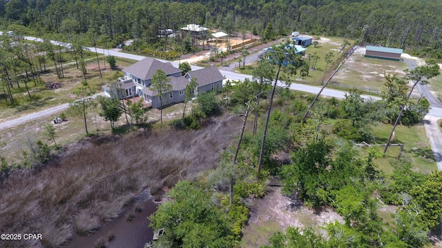 bird's eye view featuring a forest view