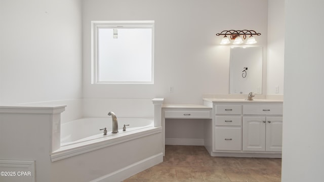 full bathroom featuring baseboards, a bath, and vanity