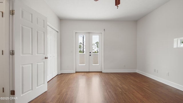 entryway with french doors, wood finished floors, and a healthy amount of sunlight