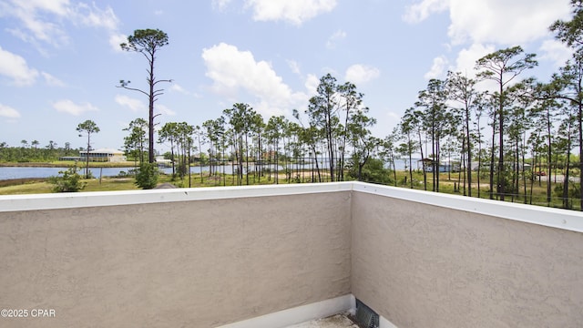 balcony featuring a water view