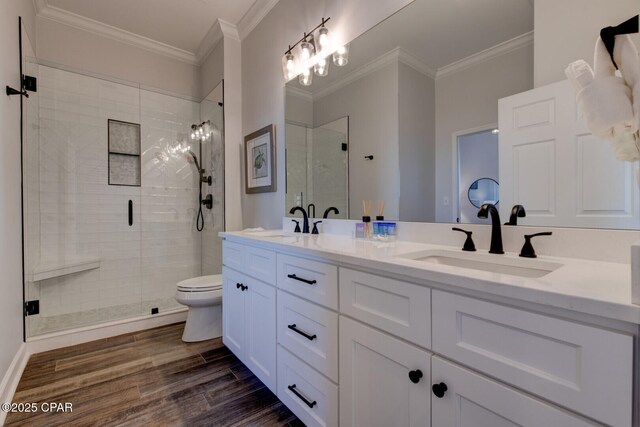 6627 Thomas Dr Unit 1702, Panama City Beach, FL 32408 - bathroom featuring a sink, wood finished floors, and ornamental molding