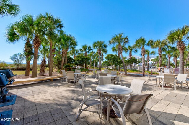 6627 Thomas Dr Unit 1702, Panama City Beach, FL 32408 - view of patio / terrace with outdoor dining area and fence