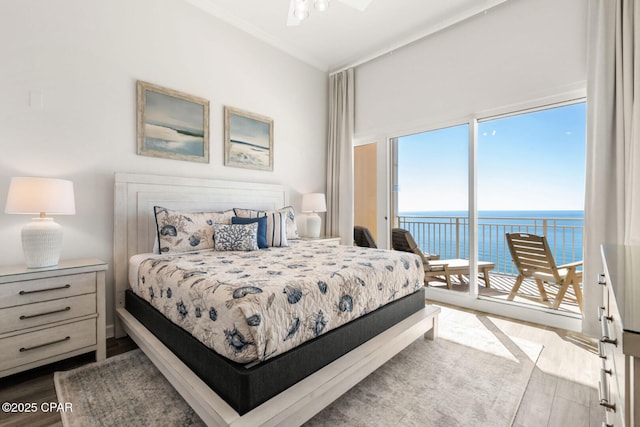 6627 Thomas Dr Unit 1702, Panama City Beach, FL 32408 - bedroom featuring access to exterior, dark wood-type flooring, and a water view
