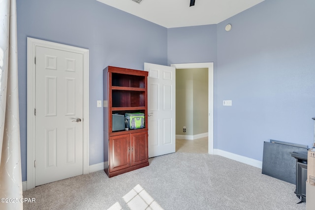 unfurnished bedroom with carpet and baseboards