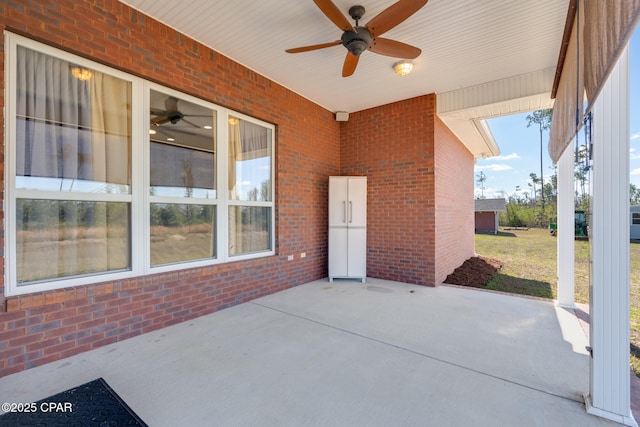 view of patio featuring ceiling fan