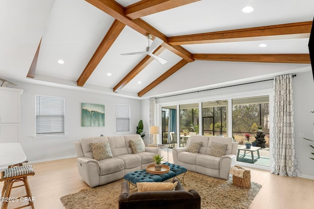 living area with vaulted ceiling with beams, light wood-style floors, baseboards, and a ceiling fan