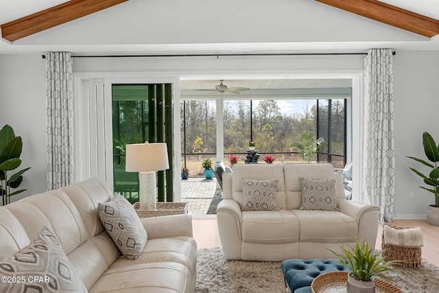 living room featuring vaulted ceiling with beams and ceiling fan