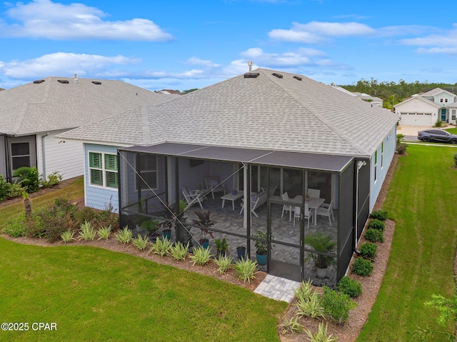 back of property featuring a yard, a lanai, and a patio