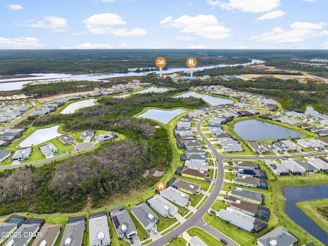 drone / aerial view featuring a water view and a residential view