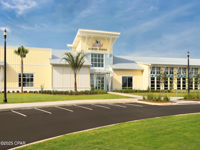 view of building exterior featuring uncovered parking