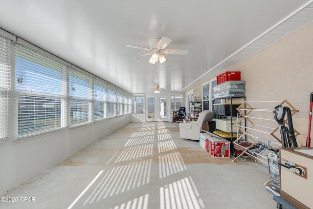 sunroom featuring a ceiling fan and a healthy amount of sunlight