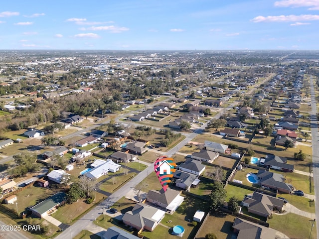 birds eye view of property with a residential view