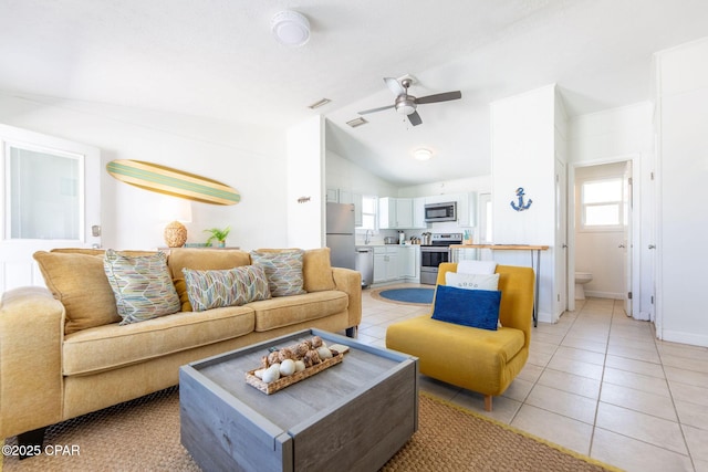 5801 Pinetree Avenue A, B, C & D, Panama City, FL 32408 - living room featuring vaulted ceiling, ceiling fan, light tile patterned floors, and baseboards