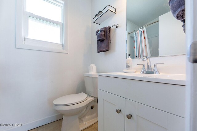 5801 Pinetree Avenue A, B, C & D, Panama City, FL 32408 - bathroom featuring toilet, vanity, tile patterned flooring, baseboards, and a shower with shower curtain