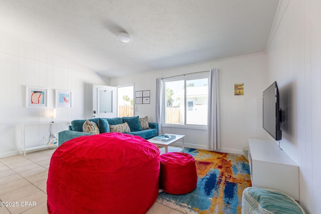 5801 Pinetree Avenue A, B, C & D, Panama City, FL 32408 - living area with vaulted ceiling, light tile patterned floors, a textured ceiling, and baseboards