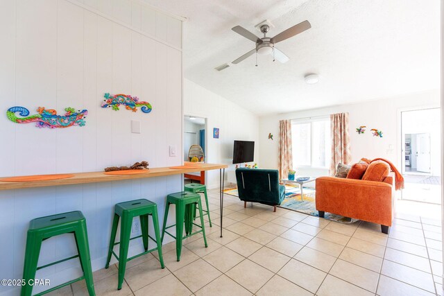 5801 Pinetree Avenue A, B, C & D, Panama City, FL 32408 - kitchen with vaulted ceiling, a kitchen breakfast bar, light tile patterned floors, open floor plan, and ceiling fan