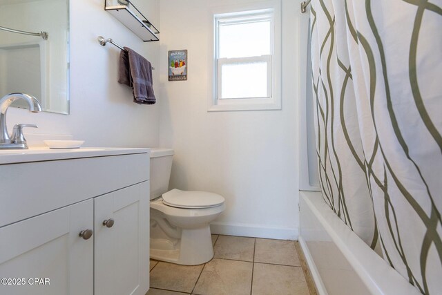 5801 Pinetree Avenue A, B, C & D, Panama City, FL 32408 - full bathroom featuring toilet, vanity, tile patterned flooring, shower / bath combo with shower curtain, and baseboards