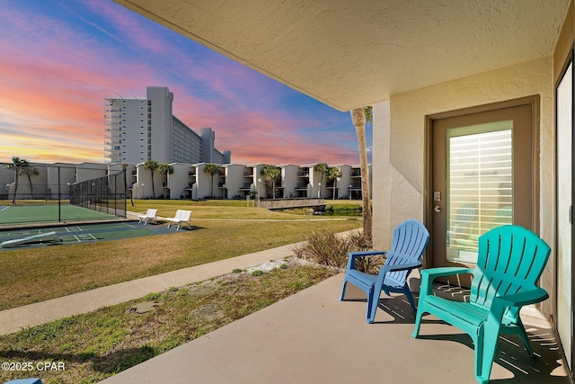 view of patio / terrace featuring fence