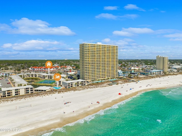 drone / aerial view with a view of the beach, a water view, and a city view