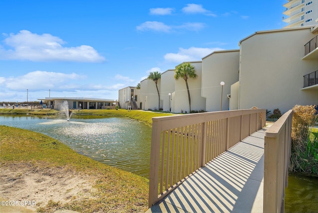 view of community with a water view