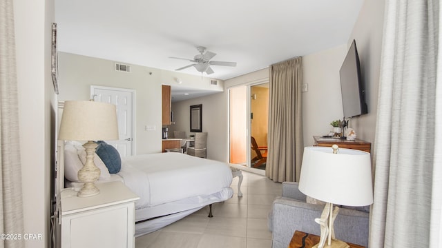 bedroom featuring visible vents, ceiling fan, and light tile patterned floors