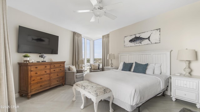 bedroom with a ceiling fan and light tile patterned floors