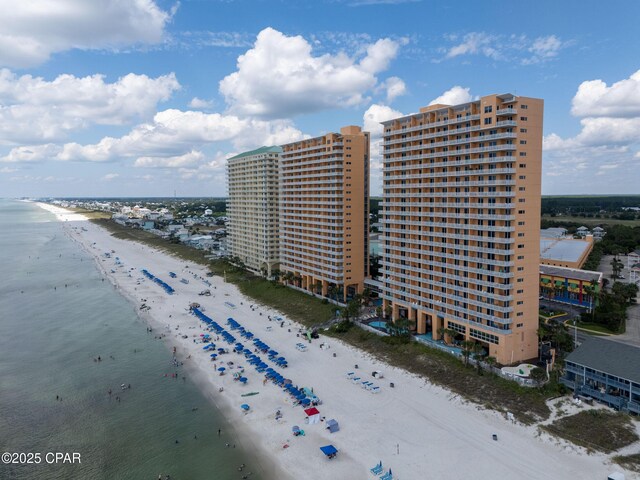 bird's eye view with a water view and a view of the beach