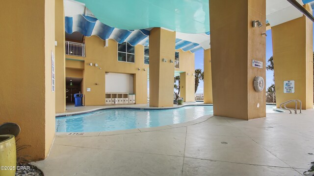 pool with a patio area