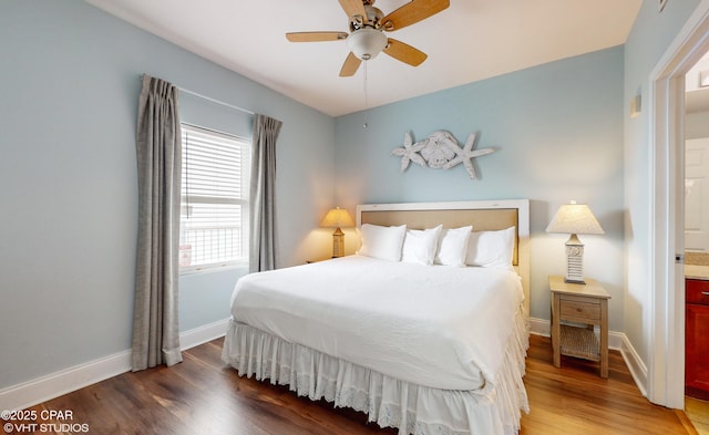 bedroom featuring ceiling fan, baseboards, and wood finished floors