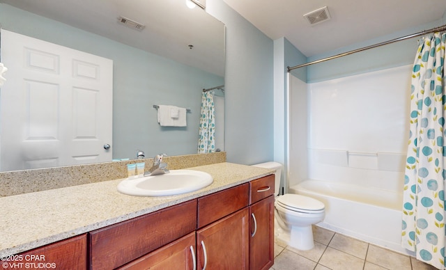 bathroom featuring visible vents, vanity, toilet, and tile patterned floors